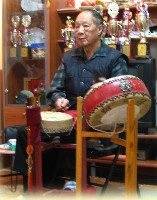 Beating gongs and playing drums