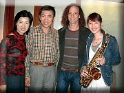 To present Kenny G with a hand-made saxophone